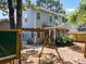 Large fenced in backyard with swing set, screened porch, and plenty of room for play at 1199 Landau Ln, Mount Pleasant, SC 29466