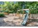 Backyard featuring a swing set with a slide, play area, and wooden privacy fence at 1199 Landau Ln, Mount Pleasant, SC 29466