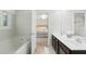 Bathroom featuring a soaking tub with access to the primary bedroom, double sinks and modern finishes at 1199 Landau Ln, Mount Pleasant, SC 29466
