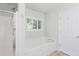 Bright bathroom featuring a soaking tub with a tile surround and a separate stand-up shower at 1199 Landau Ln, Mount Pleasant, SC 29466