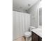 Bathroom featuring a toilet, dark wood vanity and a tub/shower combo with a curtain at 1199 Landau Ln, Mount Pleasant, SC 29466