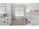 Bedroom featuring a white bunk bed, dresser and a large window allowing for natural light at 1199 Landau Ln, Mount Pleasant, SC 29466
