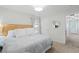 Serene bedroom featuring a comfortable bed, soft natural light, and a doorway leading to an en-suite bathroom at 1199 Landau Ln, Mount Pleasant, SC 29466