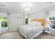 Bright bedroom with a wood headboard, neutral color scheme and windows allowing for natural light at 1199 Landau Ln, Mount Pleasant, SC 29466