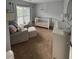 A serene Bedroom with a white crib, glider, and changing table, creating a calming and inviting space at 1199 Landau Ln, Mount Pleasant, SC 29466