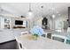 Bright dining area features stylish pendant lighting and flows into an open-concept living room and kitchen at 1199 Landau Ln, Mount Pleasant, SC 29466