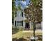 Charming two-story home with gray siding, black shutters, and a well-manicured lawn at 1199 Landau Ln, Mount Pleasant, SC 29466