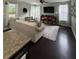 Bright living room featuring hardwood floors, a large sectional sofa and lots of natural light from the surrounding windows at 1199 Landau Ln, Mount Pleasant, SC 29466
