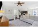 Open living room with a large sectional sofa, dark wood floors, and views into the kitchen and hallway at 1199 Landau Ln, Mount Pleasant, SC 29466