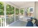 Cozy screened porch with bench and outdoor views for relaxing and entertaining at 1199 Landau Ln, Mount Pleasant, SC 29466