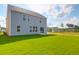 A large backyard with a grassy area, perfect for outdoor activities with patio and a view of the home at 1215 Homecoming Blvd # Cc2-1-25, Ravenel, SC 29470