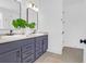 Modern bathroom with a double vanity, stylish mirrors, quartz countertops, and contemporary fixtures at 1215 Homecoming Blvd # Cc2-1-25, Ravenel, SC 29470