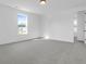 Spacious bedroom features a neutral carpet, white walls, and natural light at 1215 Homecoming Blvd # Cc2-1-25, Ravenel, SC 29470