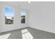 Bright bedroom featuring two windows, neutral carpet, and white walls at 1215 Homecoming Blvd # Cc2-1-25, Ravenel, SC 29470