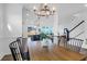 Charming dining area with modern lighting and a view into the kitchen and backyard at 1215 Homecoming Blvd # Cc2-1-25, Ravenel, SC 29470