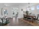 Elegant dining room with wood table, chandelier, and neutral decor, perfect for Gathering gatherings at 1215 Homecoming Blvd # Cc2-1-25, Ravenel, SC 29470
