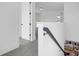 Hallway with views of the living room with plush carpet on the floor and white walls at 1215 Homecoming Blvd # Cc2-1-25, Ravenel, SC 29470