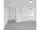 Bright hallway featuring neutral carpet, multiple doors, and white walls at 1215 Homecoming Blvd # Cc2-1-25, Ravenel, SC 29470