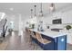 Bright kitchen with island seating, pendant lights, and a seamless transition to the dining area at 1215 Homecoming Blvd # Cc2-1-25, Ravenel, SC 29470