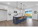 Modern kitchen with white cabinetry, stainless steel appliances, and a stylish island with seating at 1215 Homecoming Blvd # Cc2-1-25, Ravenel, SC 29470