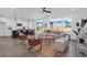 Bright open concept living space with a large island and hardwood floors at 1215 Homecoming Blvd # Cc2-1-25, Ravenel, SC 29470