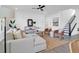 Cozy living room with modern decor, a comfortable sofa, and a stairway at 1215 Homecoming Blvd # Cc2-1-25, Ravenel, SC 29470