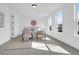 Bright and airy main bedroom showcasing a neutral color palette, accent chairs, and ample natural light at 1215 Homecoming Blvd # Cc2-1-25, Ravenel, SC 29470