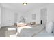 Bright main bedroom featuring a sitting area, neutral tones, and light-colored walls creating a soothing atmosphere at 1215 Homecoming Blvd # Cc2-1-25, Ravenel, SC 29470