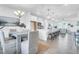 Beautiful dining area with a modern table and open view of the modern kitchen and living area at 1217 Homecoming Blvd # Cc2-1-26, Ravenel, SC 29470