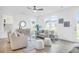 Stylish living room with neutral tones, comfortable seating, and plenty of natural light from large windows at 1217 Homecoming Blvd # Cc2-1-26, Ravenel, SC 29470
