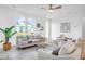 Bright living room with large windows, comfortable seating, and modern decor with natural light at 1217 Homecoming Blvd # Cc2-1-26, Ravenel, SC 29470