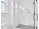 Modern bathroom shower featuring a frameless glass door, subway tile, gray tile floor, and a built-in shower niche at 1217 Homecoming Blvd # Cc2-1-26, Ravenel, SC 29470