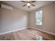 Bright bedroom with hardwood floors, a ceiling fan, mini-split AC, and a window letting in natural light at 1224 Midvale Ave, Charleston, SC 29412