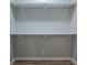 Walk-in closet with rod and shelf storage and neutral walls and baseboards; electrical outlet visible at 1224 Midvale Ave, Charleston, SC 29412