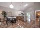 Bright, open-concept dining room features vaulted ceilings and modern pendant lighting at 1224 Midvale Ave, Charleston, SC 29412