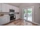 Well-equipped kitchen features stainless steel appliances and easy access to the back deck at 1224 Midvale Ave, Charleston, SC 29412