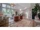 Open concept living area with a modern kitchen, comfortable seating, and hardwood floors at 1224 Midvale Ave, Charleston, SC 29412