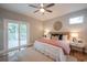 Comfortable main bedroom featuring a ceiling fan and sliding glass doors at 1224 Midvale Ave, Charleston, SC 29412