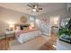 Comfortable main bedroom featuring a ceiling fan and en suite bathroom access at 1224 Midvale Ave, Charleston, SC 29412