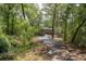 Scenic view of wooden path through lush green trees, providing a peaceful walking experience at 1224 Midvale Ave, Charleston, SC 29412