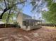 View of home's exterior with a screened porch and fenced backyard at 123 Lewisfield Dr, North Charleston, SC 29418