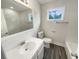 Well-lit bathroom with a large mirror, white vanity, and tile flooring at 123 Lewisfield Dr, North Charleston, SC 29418