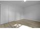 Bright bedroom featuring modern flooring, a large closet, and fresh paint at 123 Lewisfield Dr, North Charleston, SC 29418