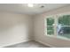 Bedroom bathed in light from two windows, features updated vinyl plank flooring at 123 Lewisfield Dr, North Charleston, SC 29418