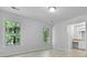 Bright bedroom with two windows showing views of the surrounding green trees at 123 Lewisfield Dr, North Charleston, SC 29418