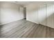 Bedroom features modern vinyl flooring and a closet with white bi-fold doors at 123 Lewisfield Dr, North Charleston, SC 29418