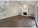 Spacious living room with a fireplace, built-in shelves, and staircase at 123 Lewisfield Dr, North Charleston, SC 29418