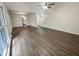 Open-concept living area with wood flooring and natural light from large windows at 123 Lewisfield Dr, North Charleston, SC 29418