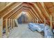 Spacious attic with exposed wooden beams and ample storage or potential living space at 125 Eston Dr, Goose Creek, SC 29445
