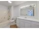 Well-lit bathroom features a bathtub with shower and a vanity with ample storage space at 125 Eston Dr, Goose Creek, SC 29445